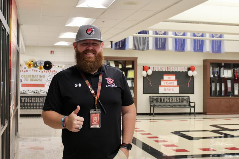 Coach with thumbs up