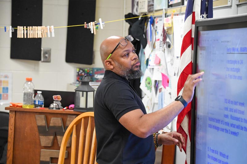 male elementary student at desk