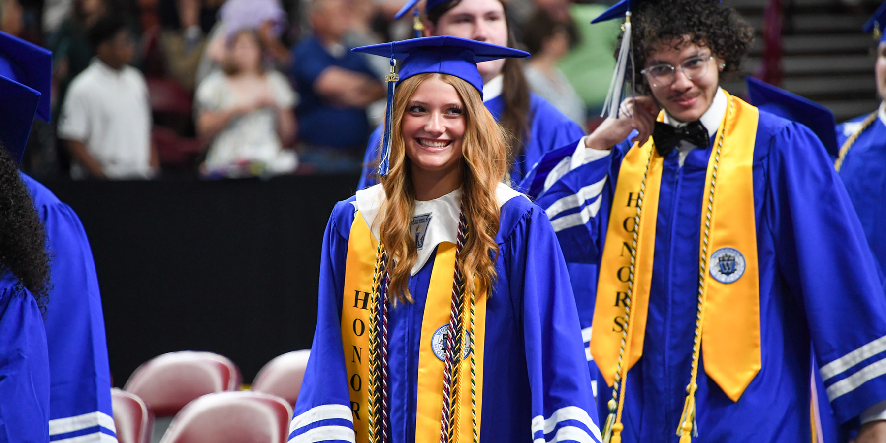 high school student in graduation robe
