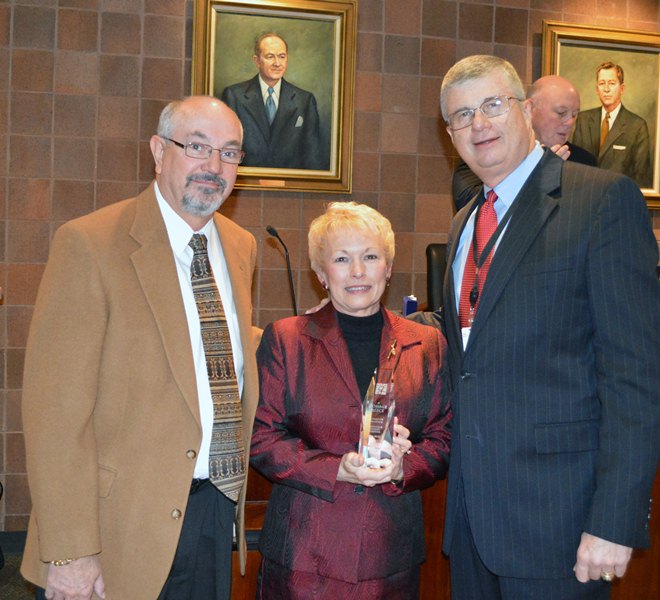 Left to Right: Board Chairman Roger Meek, Mrs. Tommie Reece, and Superintendent W. Burke Royster