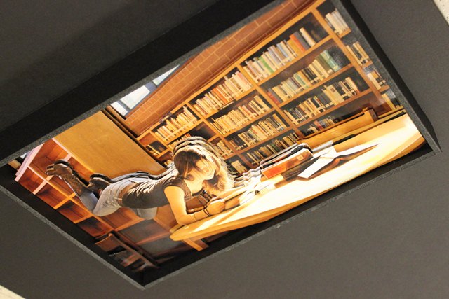 photo of levitating girl in library 2