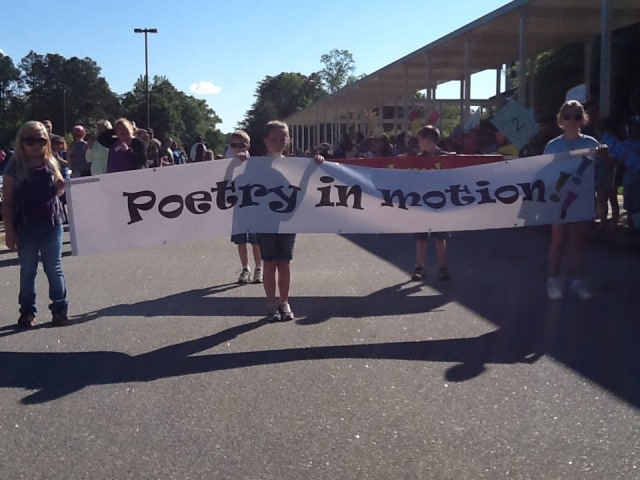 Students marching with a banner 
