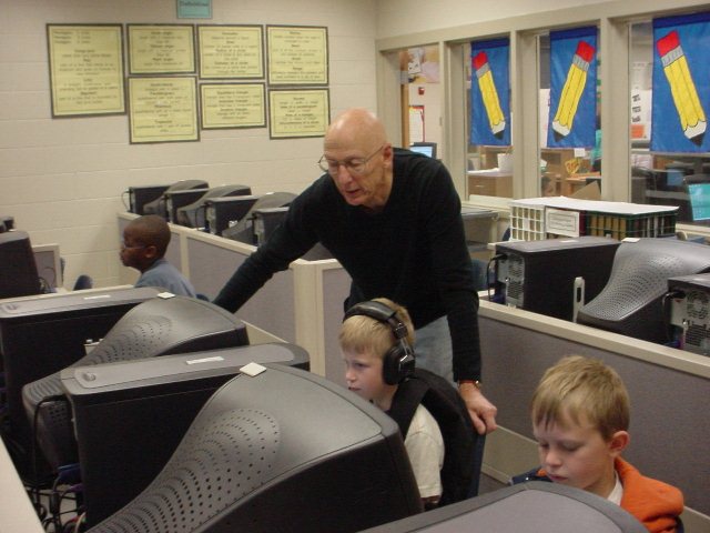 Peter Bergstrom helping a student on the computer