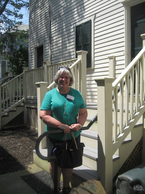 Mary stands beside the door the Frederick Douglass entered when he arrived in New Bedford after escaping slavery.