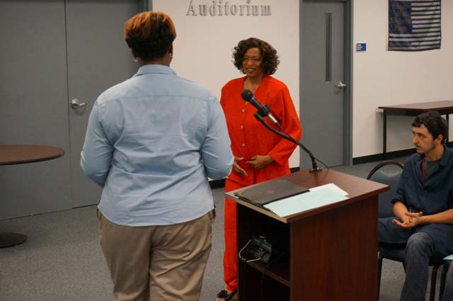 Instructor La’Tonia Moore presents Vice Mayor Pro Tem Lillian Flemming with a certificate of appreciation.