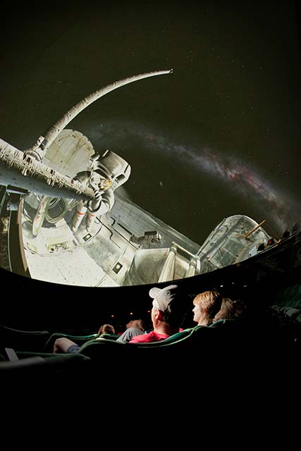students in the planetarium