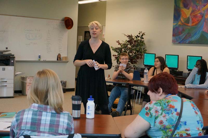 Sarah Blackman in classroom talking to students