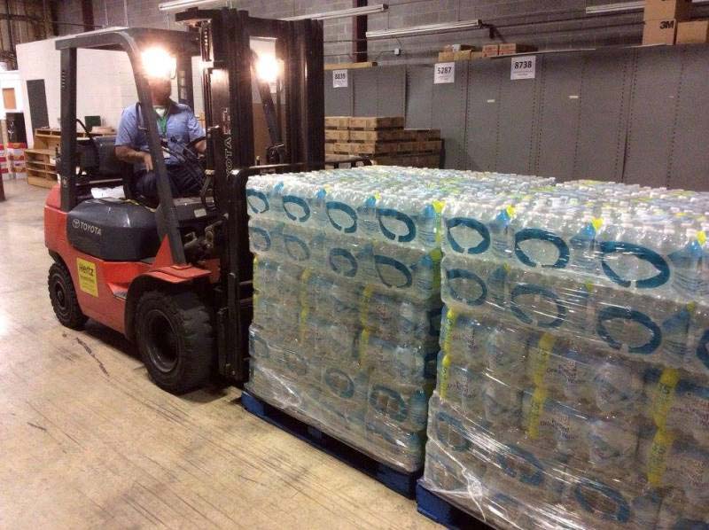Forlift with cases of bottled water