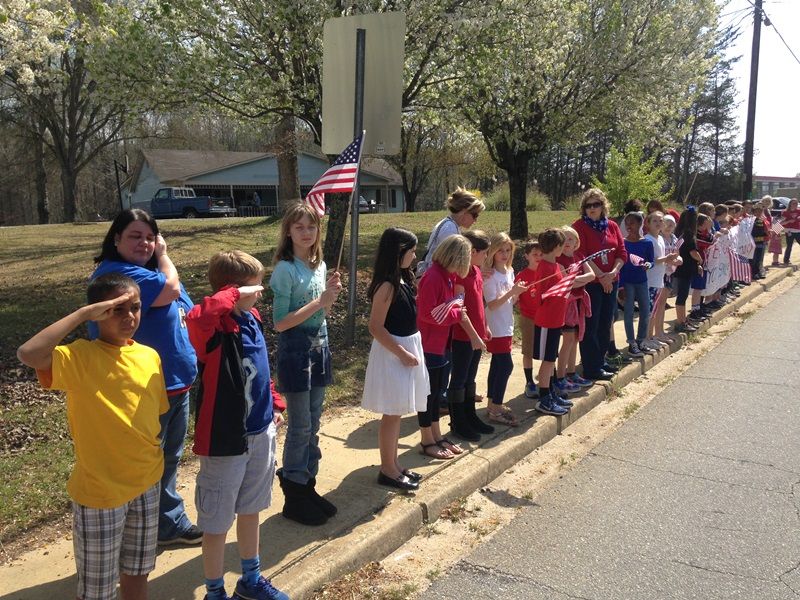 Heritage Elementary students show their respects to Officer Jacobs.-6