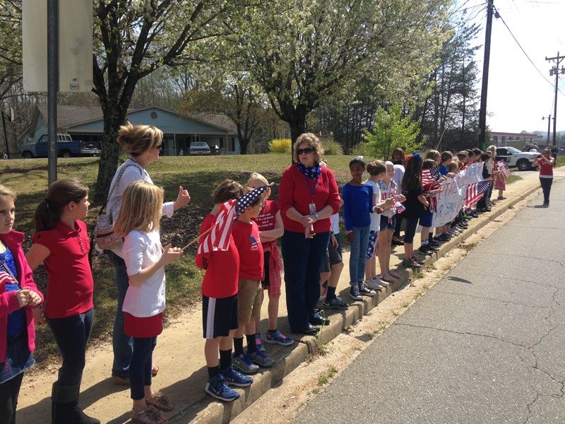 Heritage Elementary students show their respects to Officer Jacobs.-7