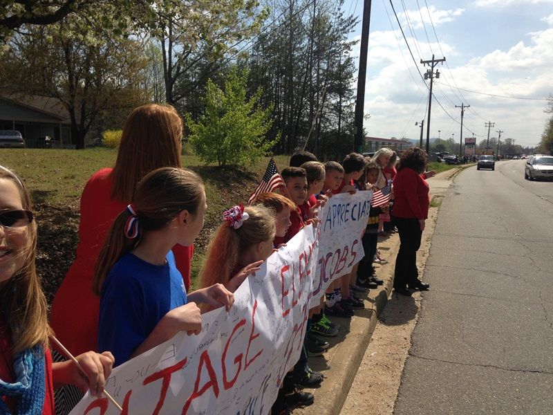 Heritage Elementary students show their respects to Officer Jacobs.-11
