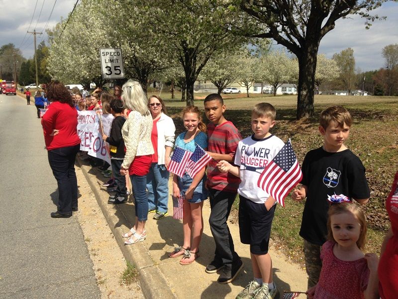 Heritage Elementary students show their respects to Officer Jacobs.-12
