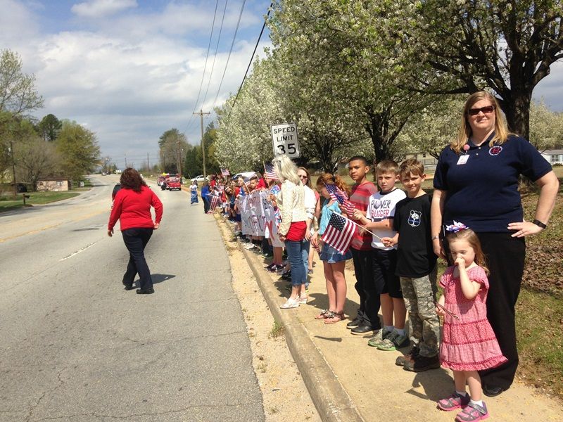 Heritage Elementary students show their respects to Officer Jacobs.