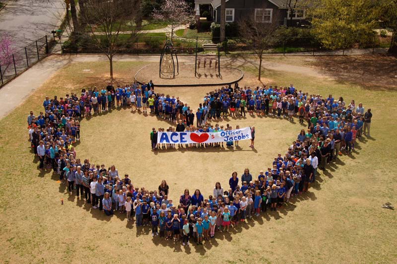 Students at Augusta Circle Elementary where Jacobs had visited dressed in blue and formed the shape of heart on the school playground.