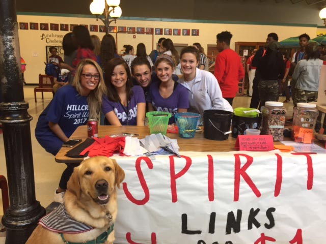Photo of students with Spirit banner