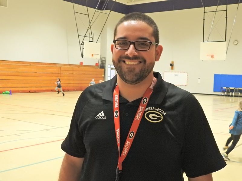 Mr. Santos uses his role as PE teacher to encourage students to have fun and enjoy physical activity.