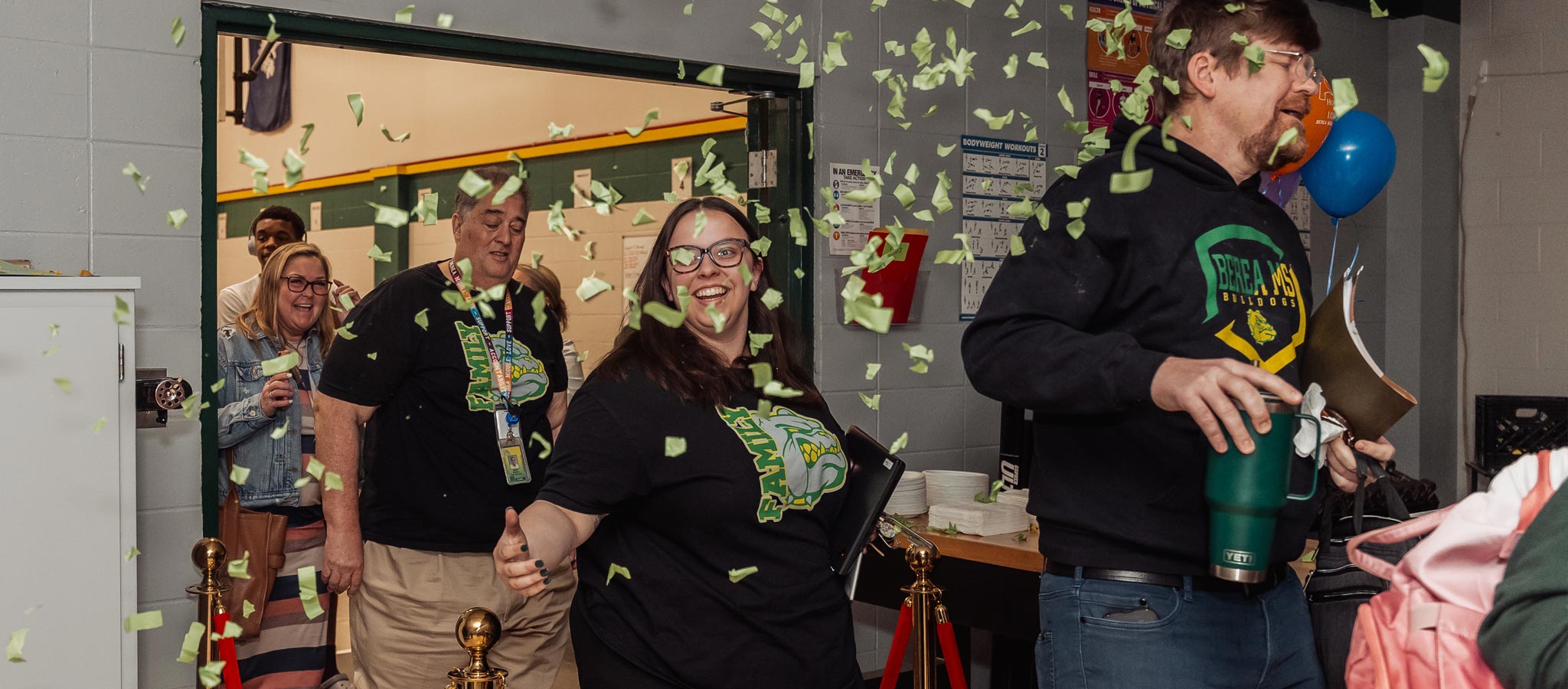 teachers walking in room in celebration