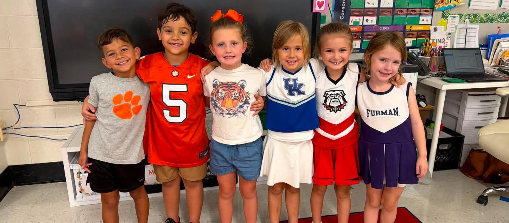 students dressed in college team attire