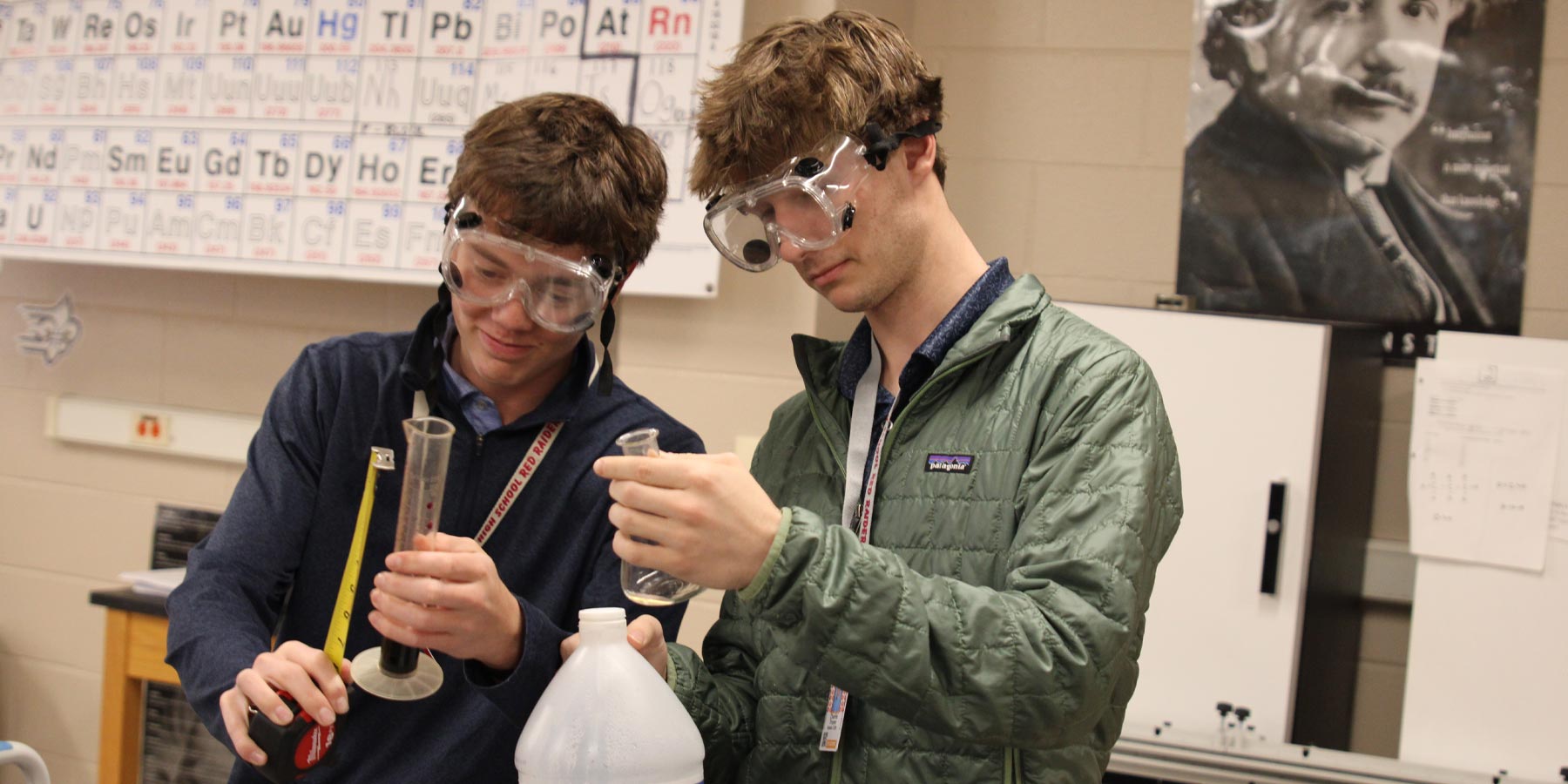 chemistry students working with beakers