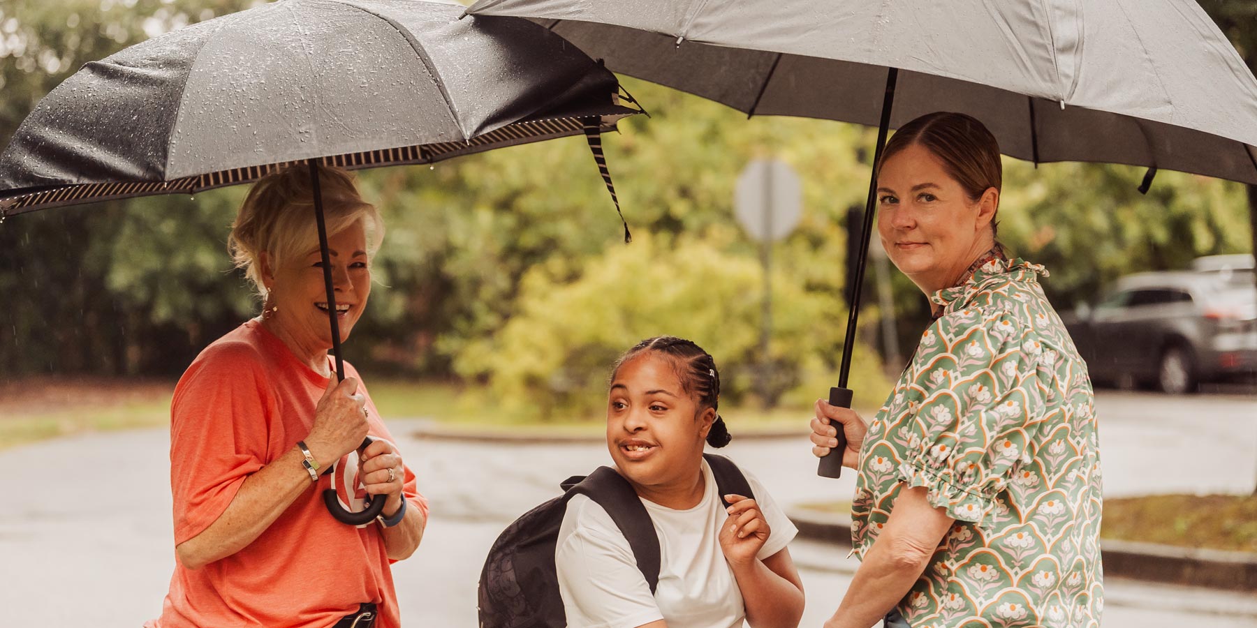 Waiting on the bus in the rain