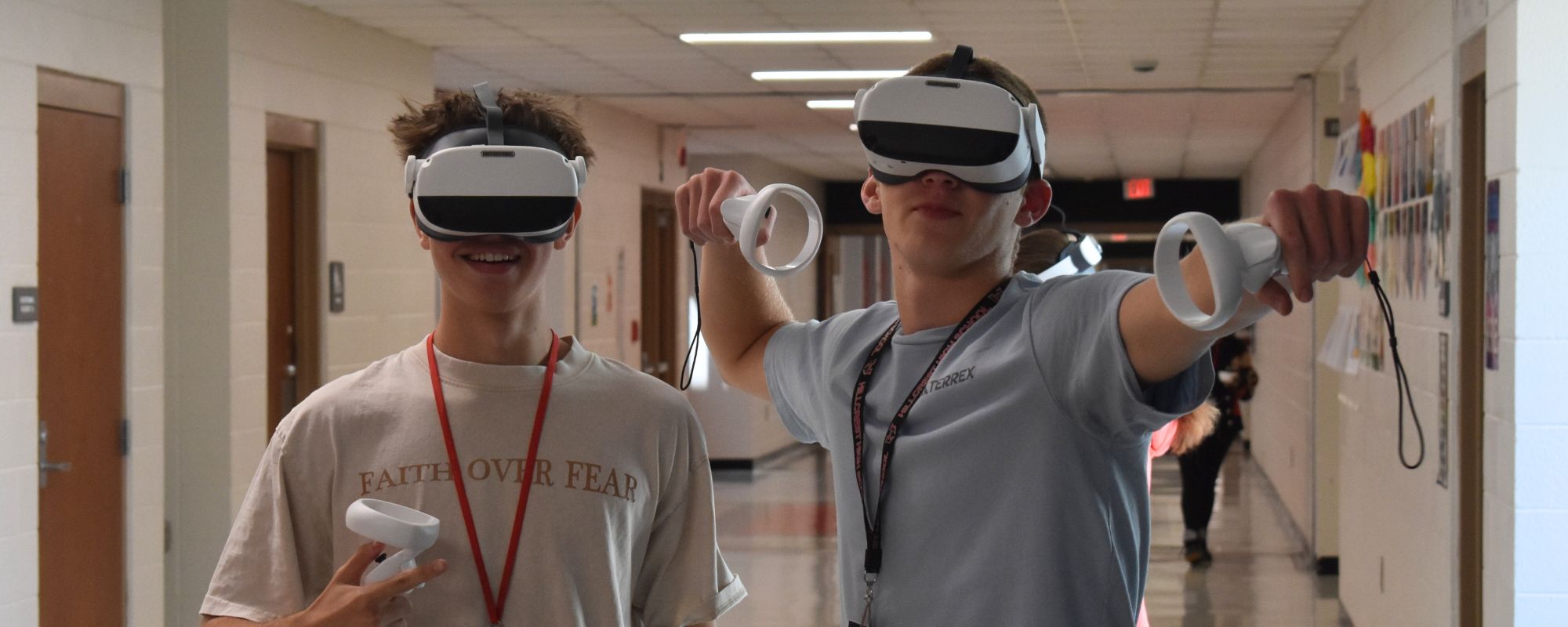 group of students who volunteered to clean trash on highway in yellow vests, many with trash pick up tools
