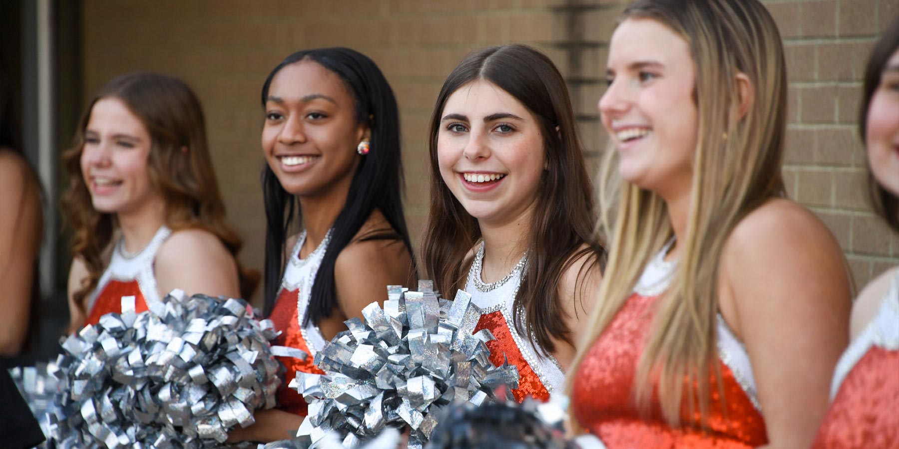 four high school cheerleeders