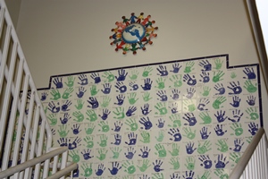 Community hand print tiles in stairwell