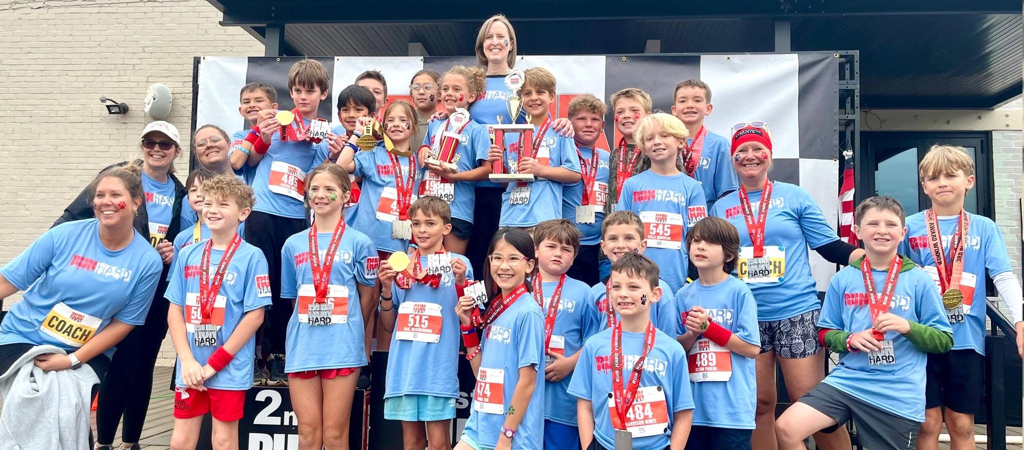 group of students holding trophy