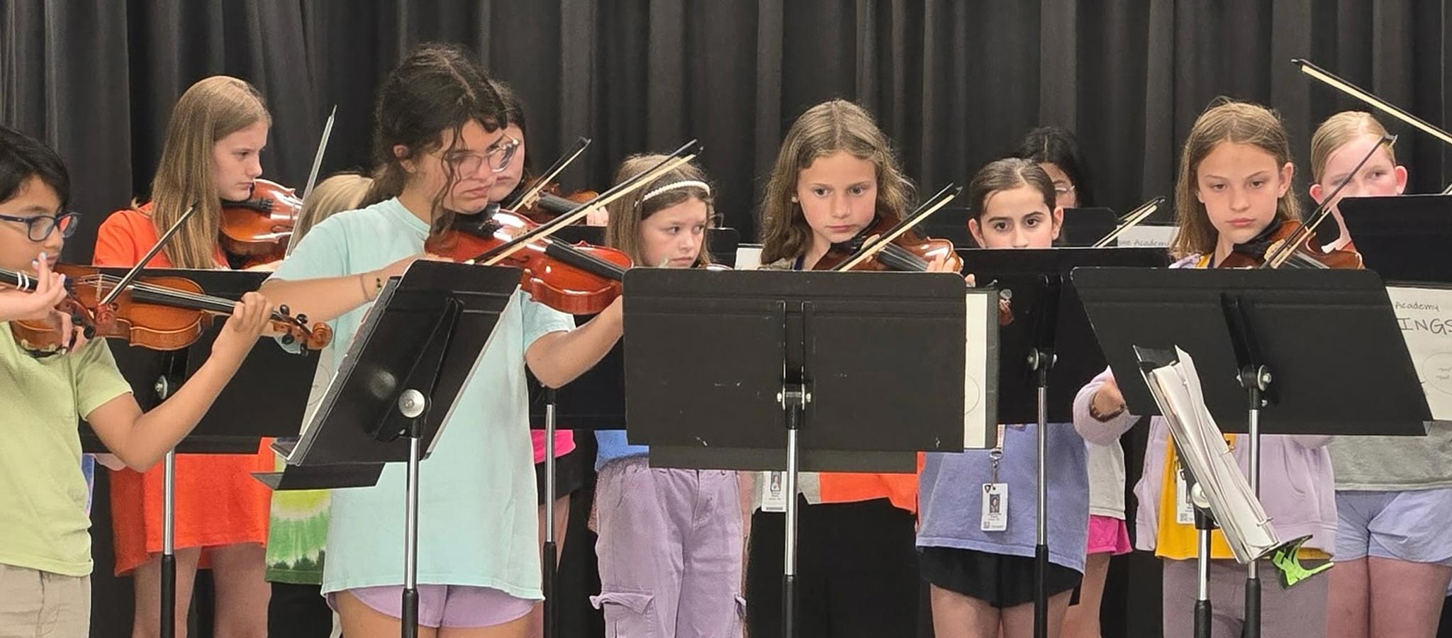 Group of students playing violins