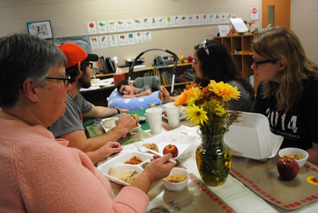 Zachary Ells, student at Washington Center at Hollis, enjoys Thanksgiving feast with his family