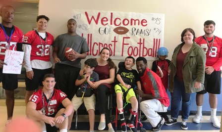 Ryana Smith-Wilson’s Washington Center class is visited by Hillcrest senior football players for a lesson about the sport. 