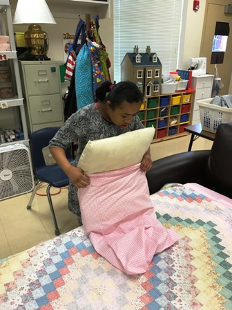Washington Center student Serenity Watson practices academic and functional skills for independence in Daily Living class under the direction of teacher Sarah Ashworth.
