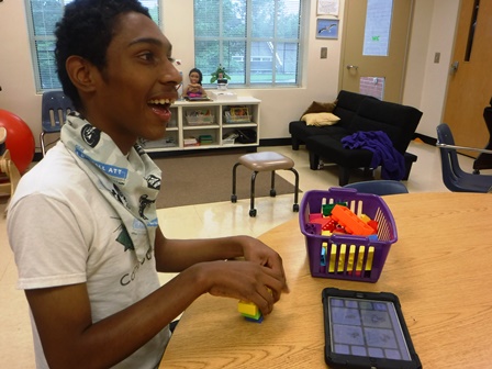 Washington Center student Frankie Robinson learns and creates using Lego blocks.