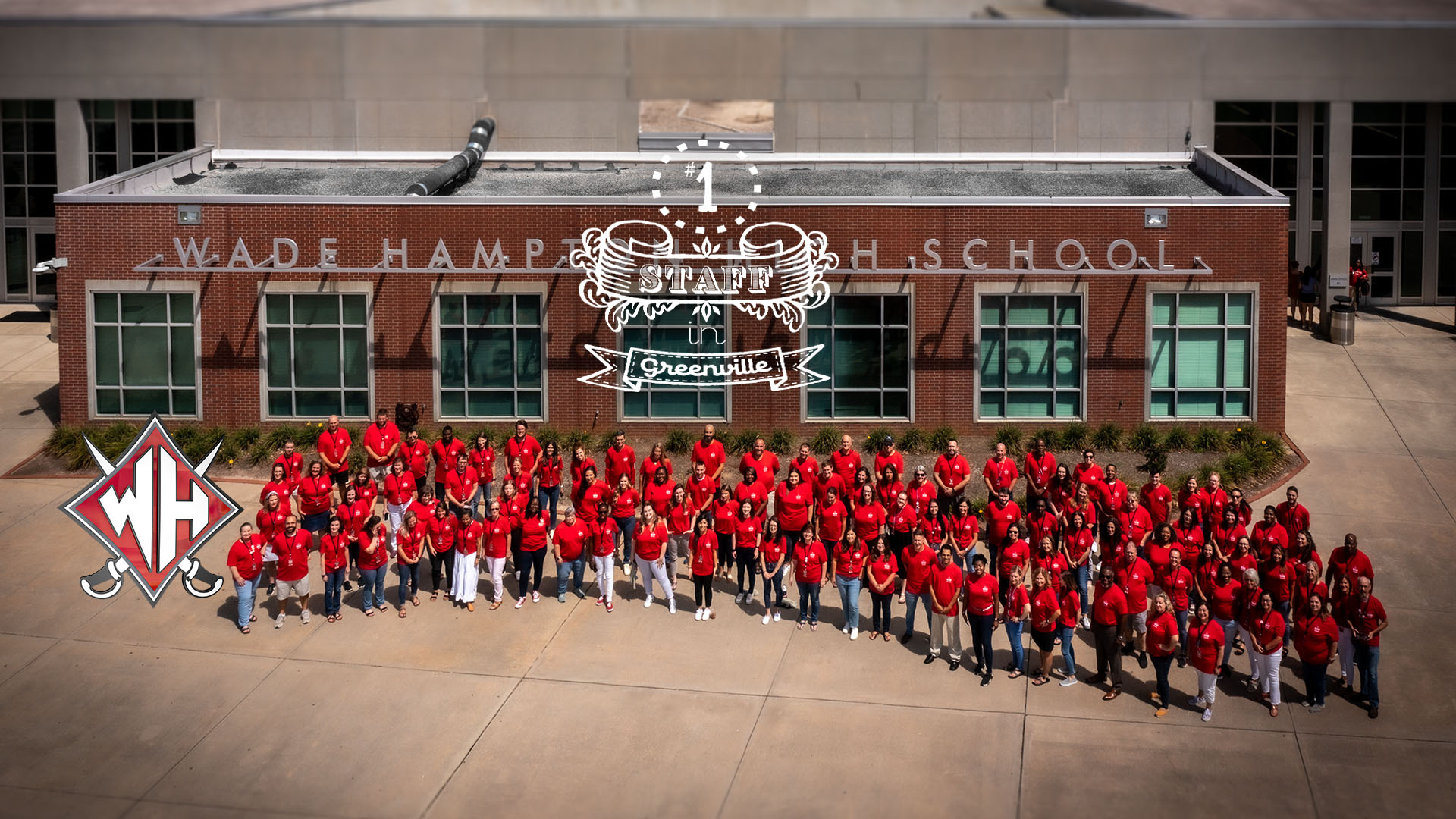 View of our faculty from in front of the school. White text states #1 staff in Greenville County