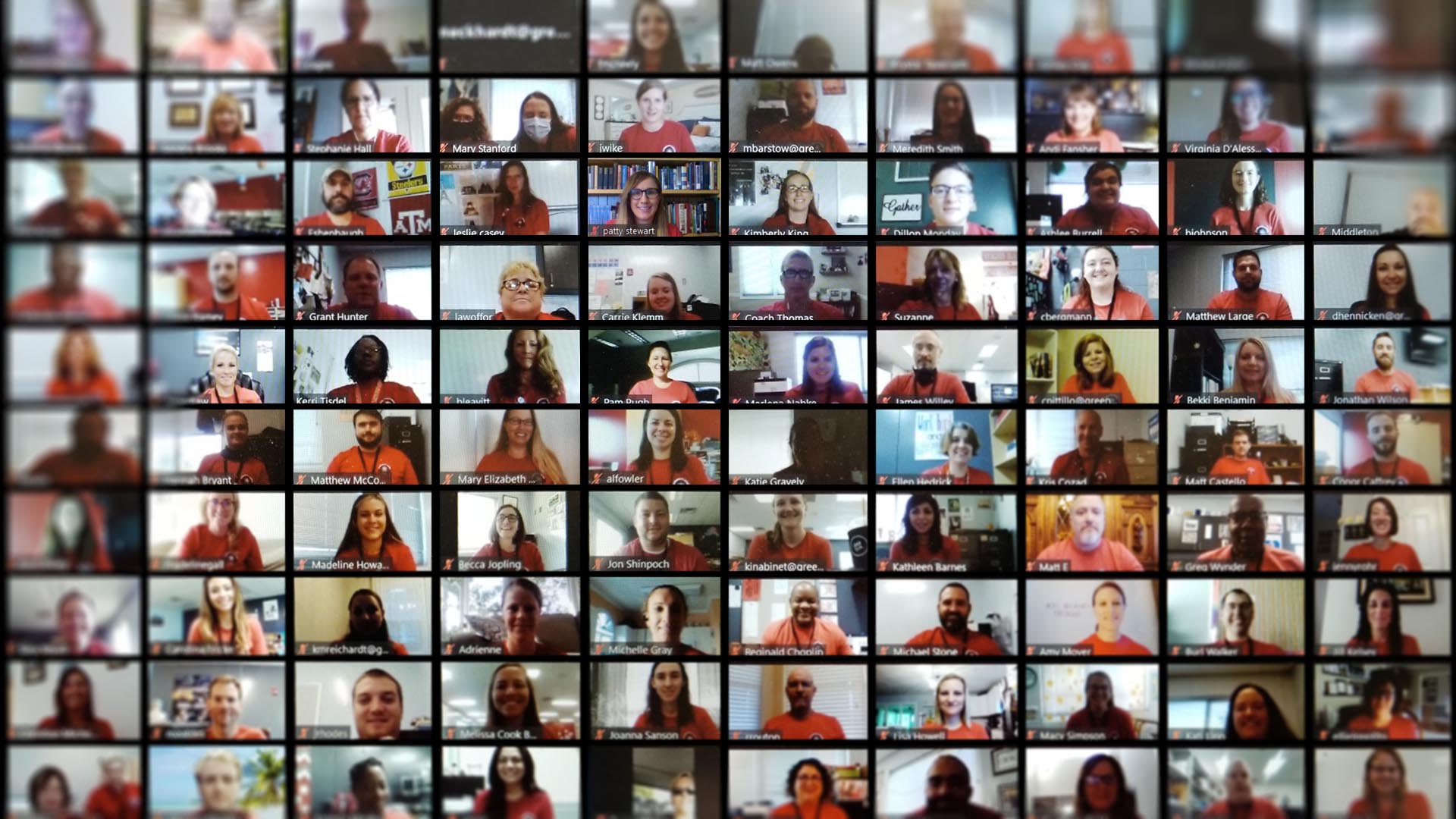 View of many faculty faces from a screenshot of a zoom meeting.